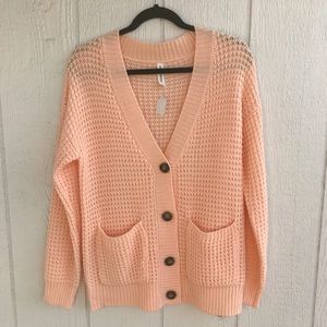 New cardigan sweater. Pretty peach, with tortoise colored buttons.